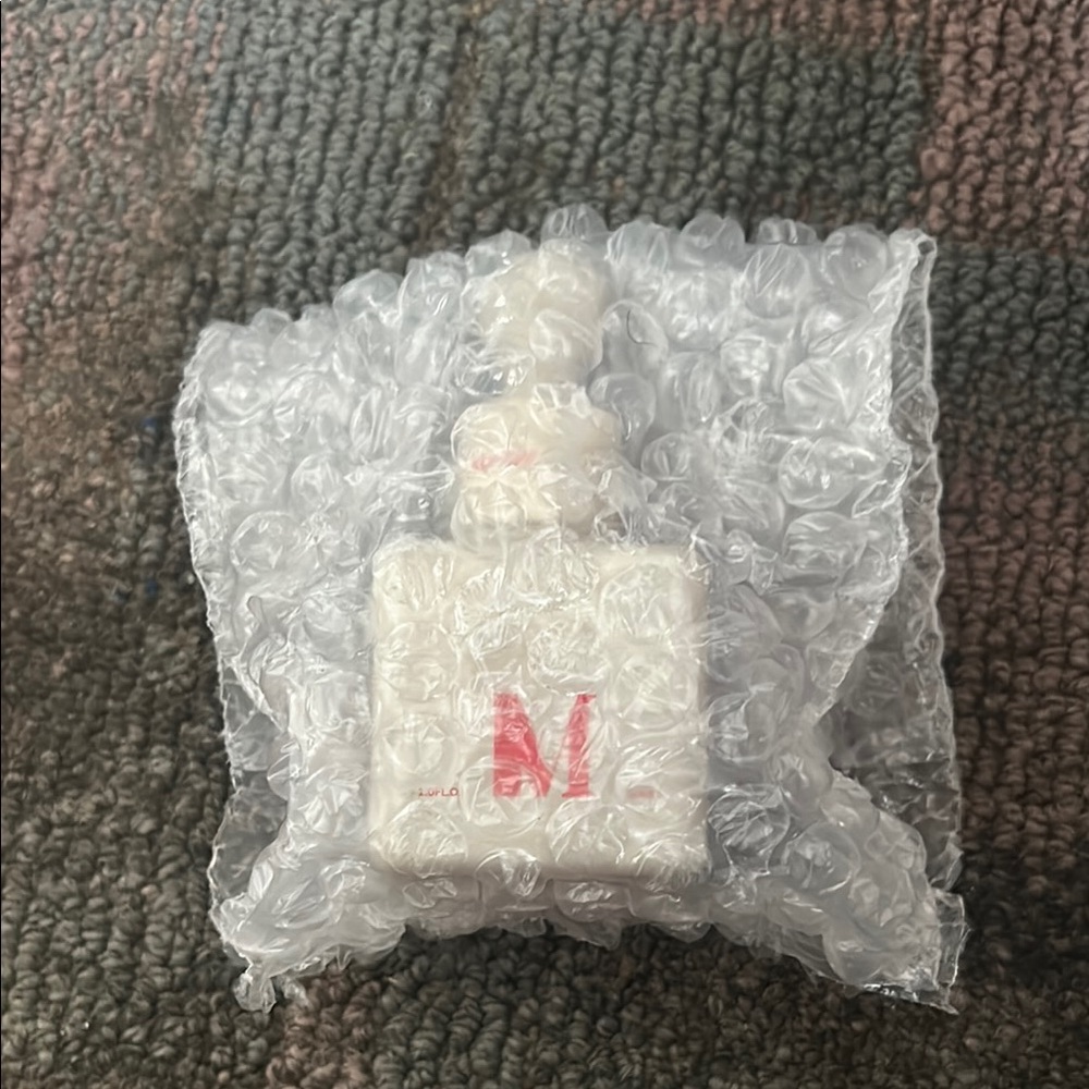 White Bottle with Red Lettering